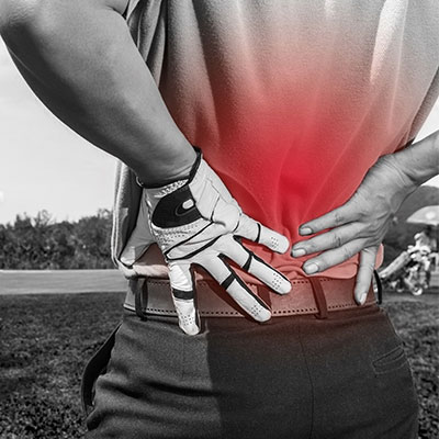 golfer holding lower back in pain