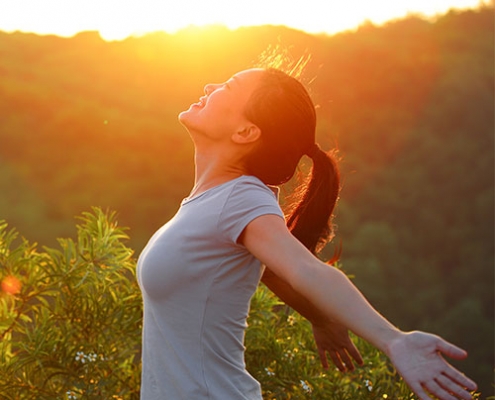 Woman experiencing wellness in sunshine
